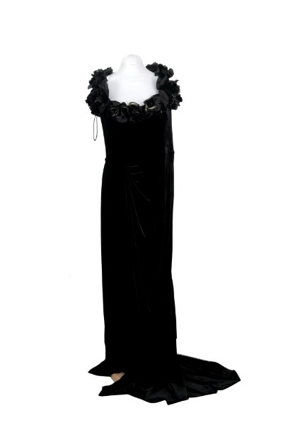 Picture of Elegant Marchesa black velvet gown featuring a dramatic floral appliqué neckline and floor-length silhouette with train.